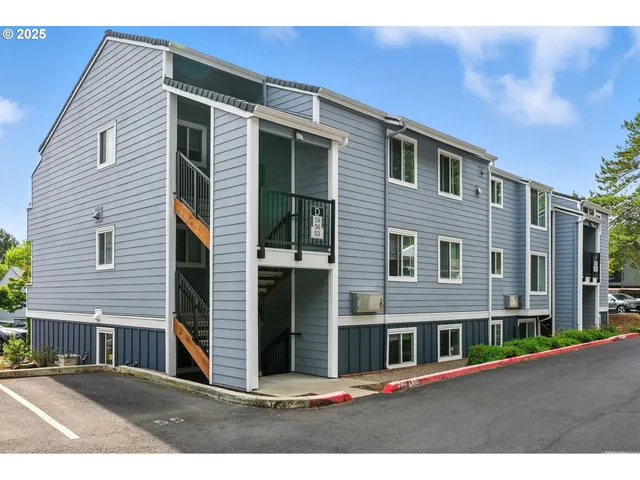 a front view of a house with large windows