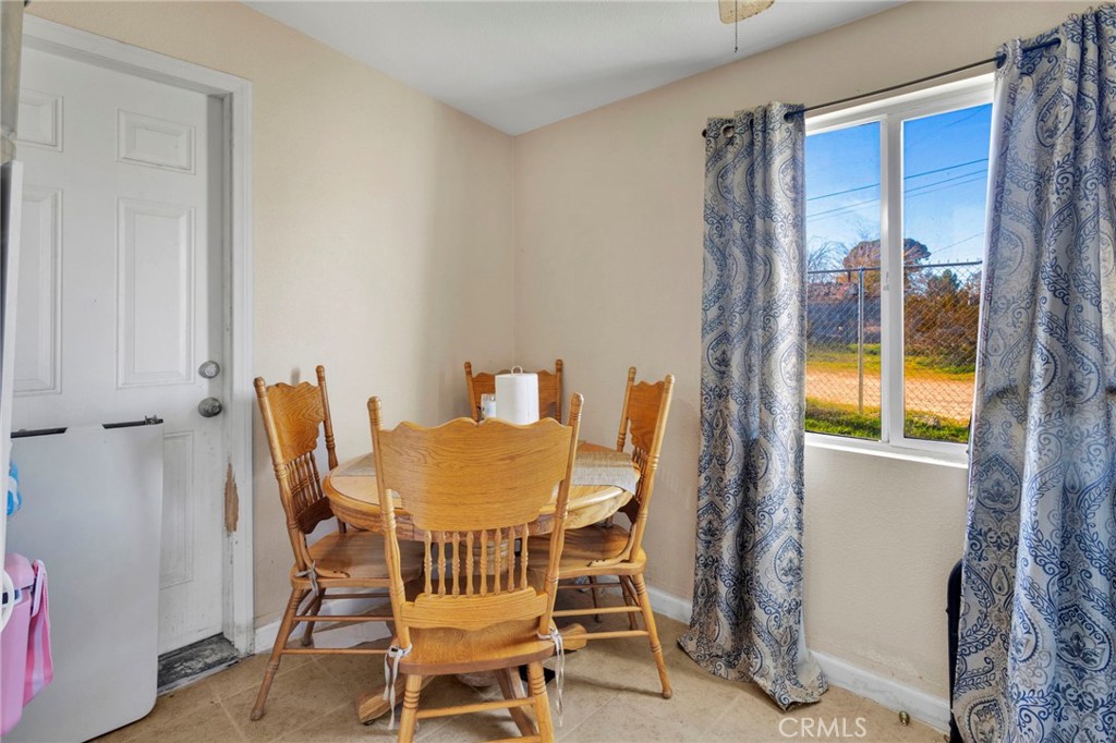 25466 Jasper Road Barstow, CA 92311 - Photo 18 of 22 a dining room with furniture and window
