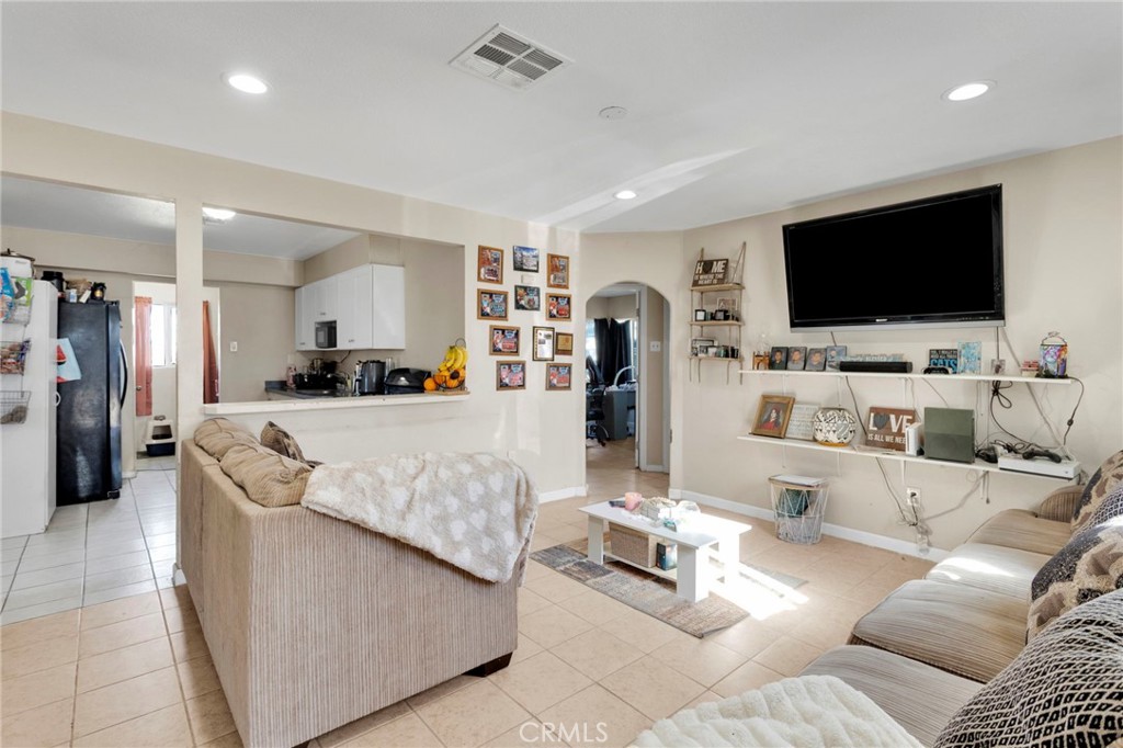 25466 Jasper Road Barstow, CA 92311 - Photo 5 of 22 a living room with furniture and a flat screen tv