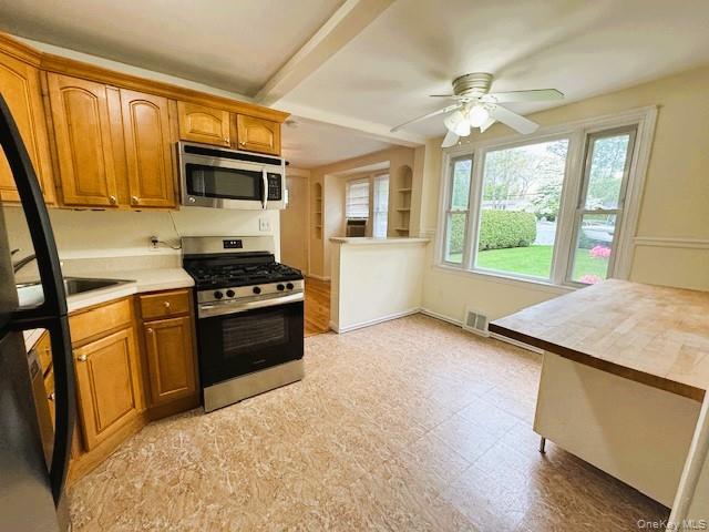 42 Hamilton Road, Unit LEFT North Merrick, NY 11566 - Photo 8 of 24 Kitchen featuring a Kitchen Nook with a large window overlooking the Entertaining Backyard and Patio.