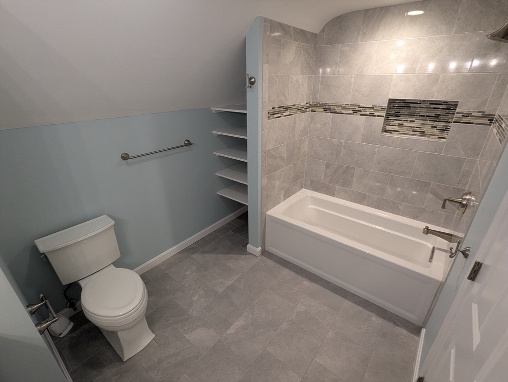 185 Mystic Street, Unit 2 Arlington, MA 02474 - Photo 17 of 33 a bathroom with a toilet and a shower