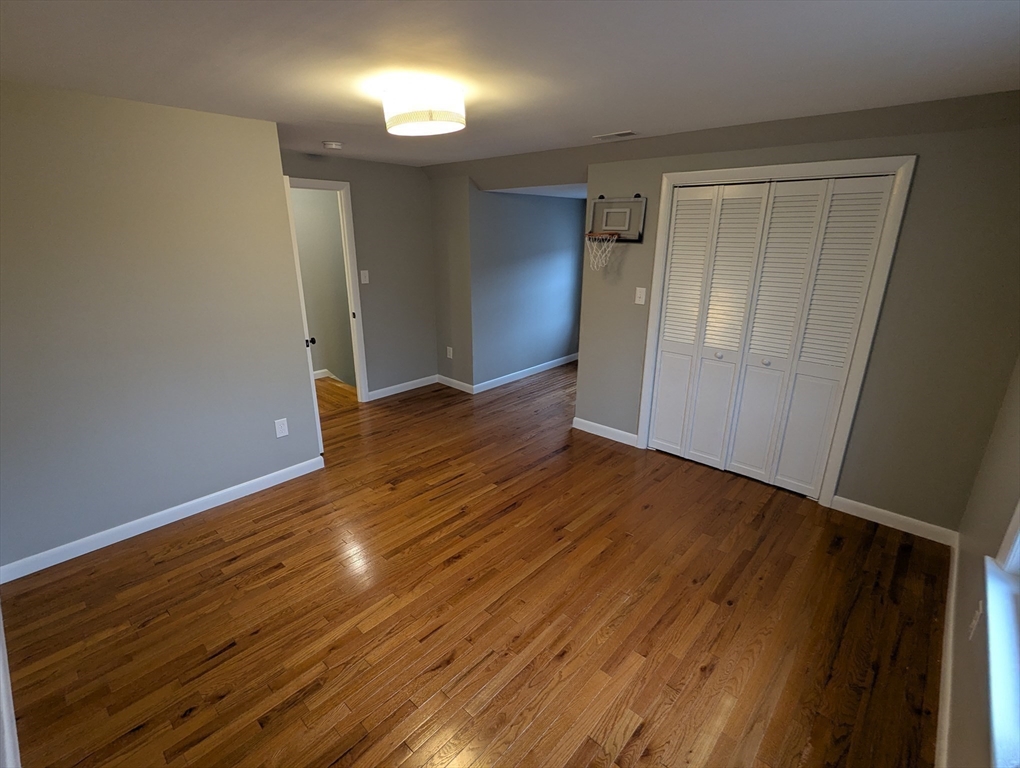 185 Mystic Street, Unit 2 Arlington, MA 02474 - Photo 20 of 33 a view of empty room with wooden floor