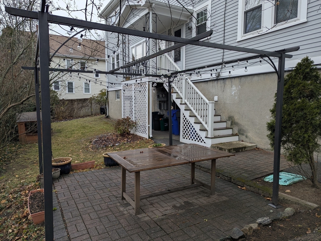 185 Mystic Street, Unit 2 Arlington, MA 02474 - Photo 32 of 33 a view of a house with a patio