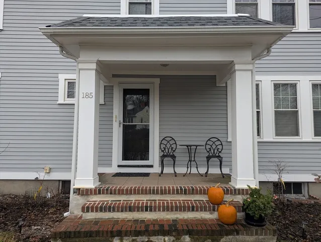 a view of a house with outdoor space and sitting area