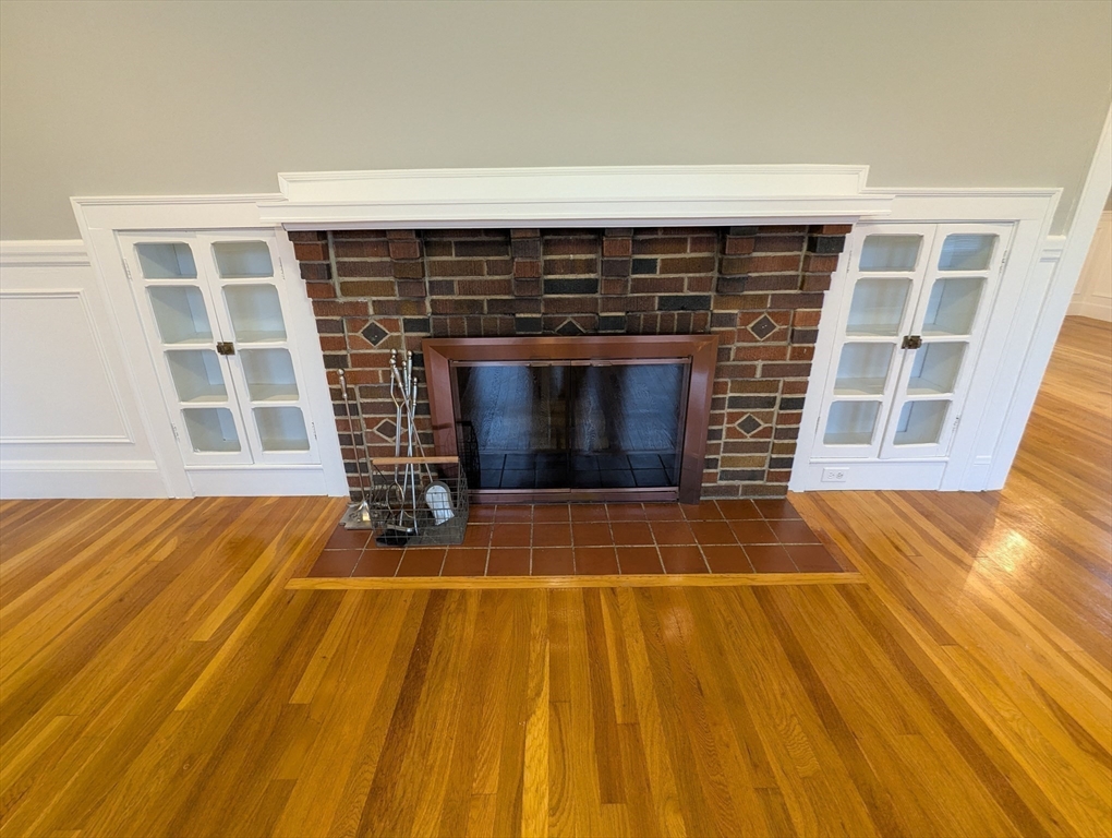 185 Mystic Street, Unit 2 Arlington, MA 02474 - Photo 9 of 33 a view of a room with wooden floor and door