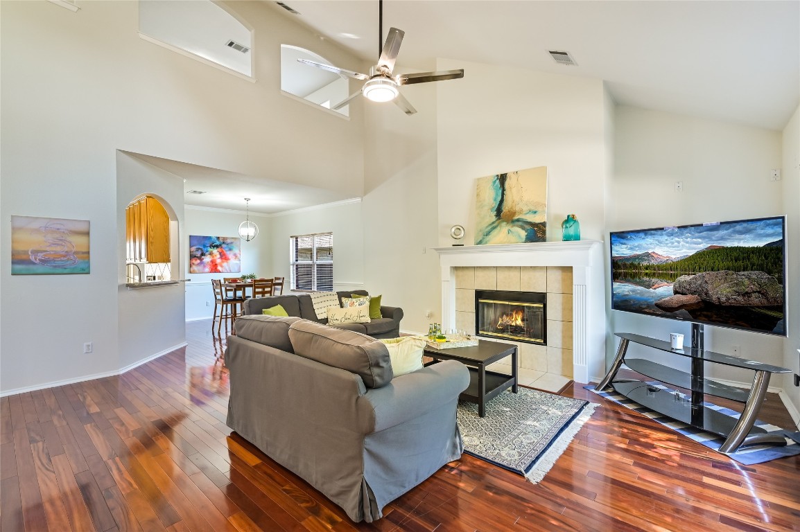 7008 Wandering Oak Road Austin, TX 78749 - Photo 1 of 1 a living room with furniture a fireplace and a flat screen tv