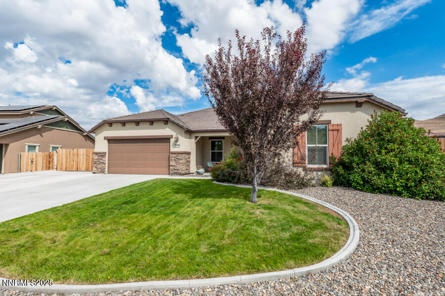 2745 Trail Rider Drive Reno, NV 89521 - Photo 1 of 50 a view of a house with a backyard