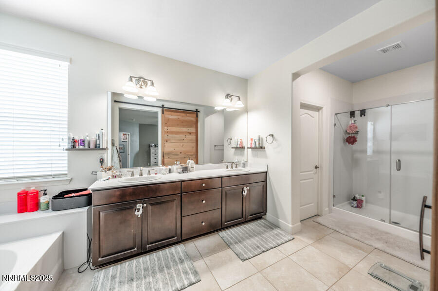 2745 Trail Rider Drive Reno, NV 89521 - Photo 24 of 50 a spacious bathroom with a granite countertop sink mirror and shower