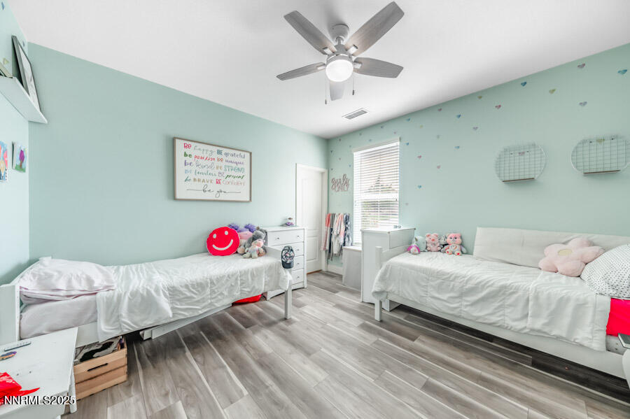 2745 Trail Rider Drive Reno, NV 89521 - Photo 31 of 50 a bedroom with a bed and a chandelier