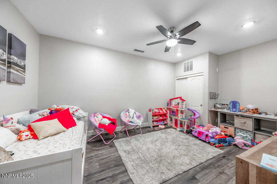 2745 Trail Rider Drive Reno, NV 89521 - Photo 34 of 50 a bedroom with furniture and a chandelier