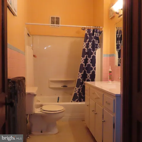 a kitchen with cabinets appliances a sink and a counter top space
