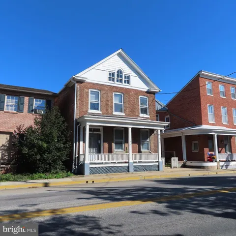 a view of a park with large trees