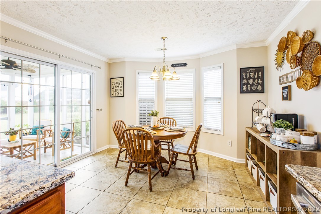 1909 Yellowbrick Road Fayetteville, NC 28314 - Photo 12 of 25 a dining room with furniture and window