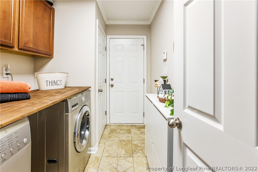 1909 Yellowbrick Road Fayetteville, NC 28314 - Photo 17 of 25 a utility room with dryer and washer