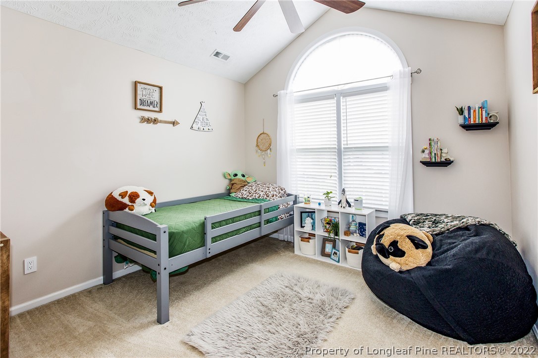 1909 Yellowbrick Road Fayetteville, NC 28314 - Photo 19 of 25 a bedroom with furniture and a window