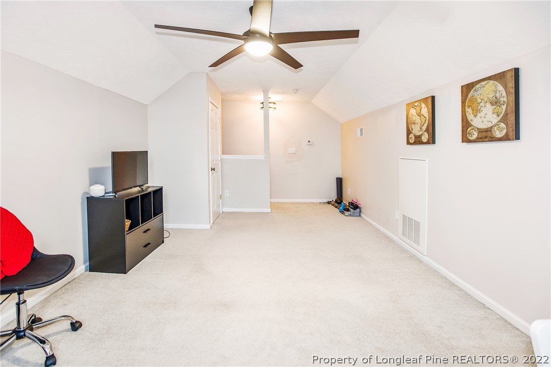 1909 Yellowbrick Road Fayetteville, NC 28314 - Photo 25 of 25 a view of a livingroom with furniture and a ceiling fan