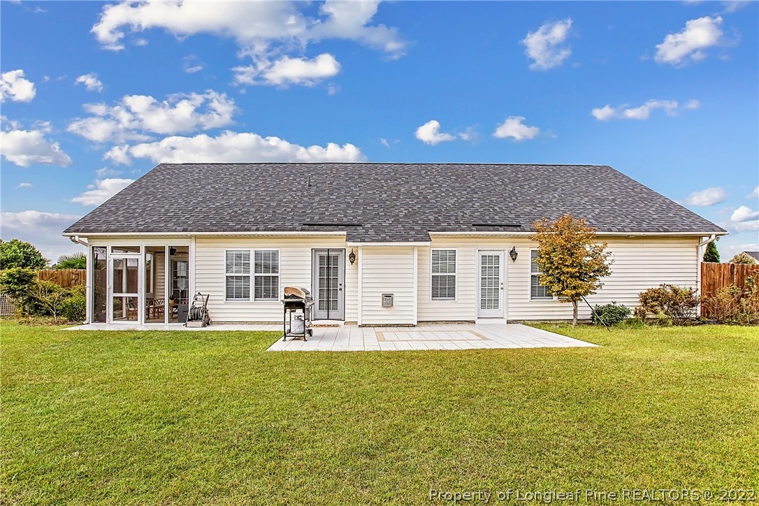 1909 Yellowbrick Road Fayetteville, NC 28314 - Photo 3 of 25 a front view of a house with a garden and patio