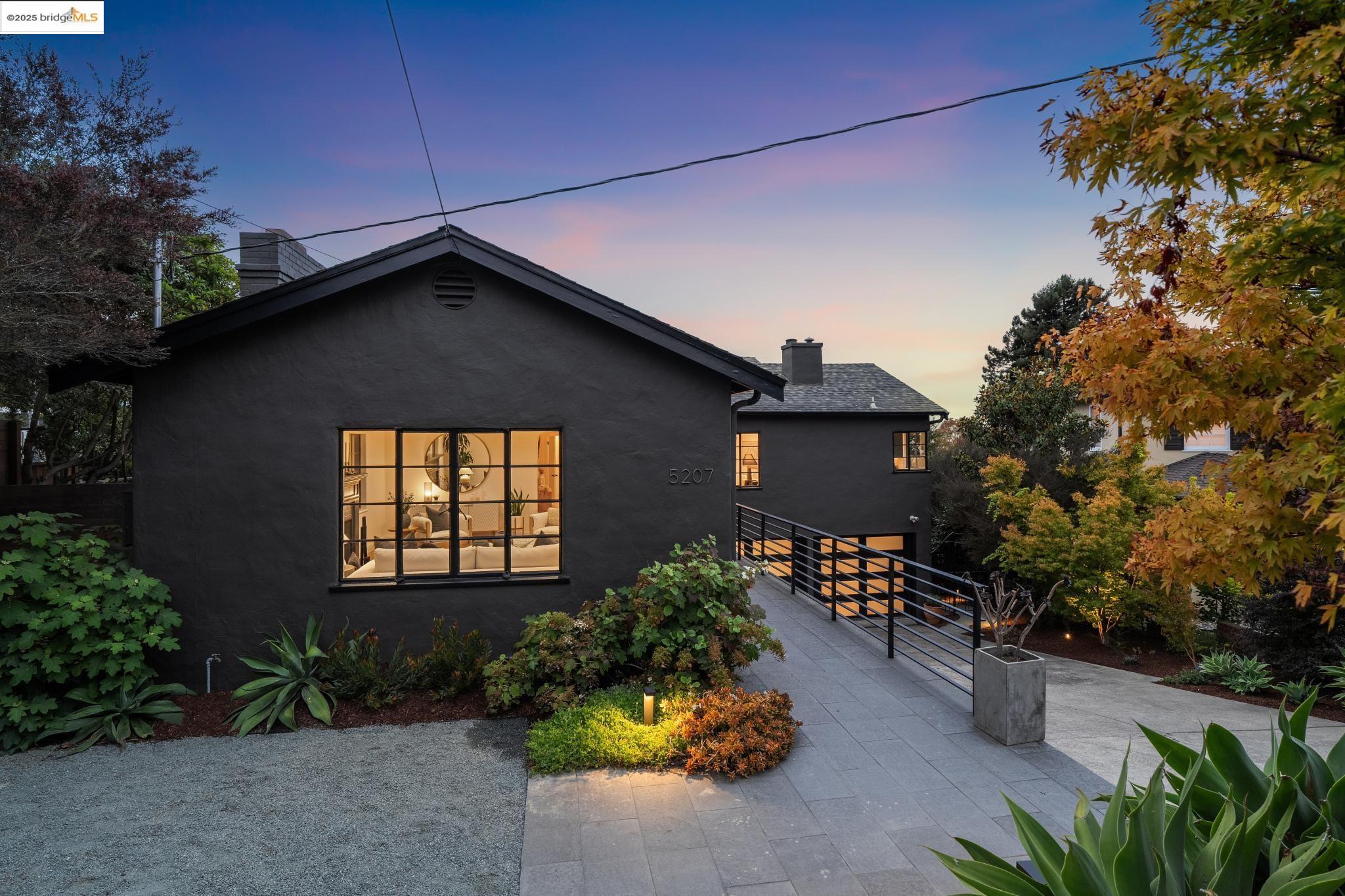 5207 Masonic Avenue Oakland, CA 94618 - Photo 3 of 55 View of front of property with a chimney, stucco siding, and a patio