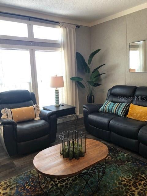 101 Tomahawk Road Hawthorne, FL 32640 - Photo 13 of 25 a living room with furniture wooden floor and a large window