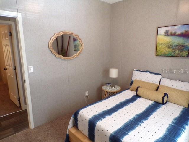 101 Tomahawk Road Hawthorne, FL 32640 - Photo 21 of 25 a bedroom with a bed and a mirror