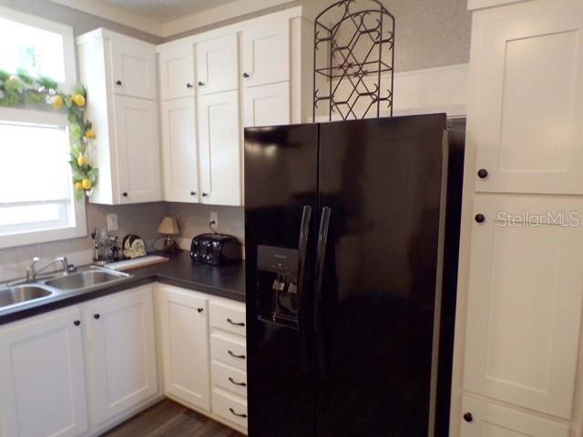 101 Tomahawk Road Hawthorne, FL 32640 - Photo 8 of 25 a kitchen with a refrigerator and cabinets