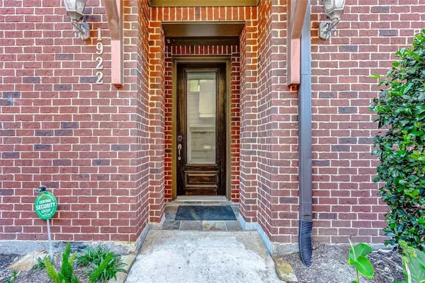 a view of front door of house with potted plant