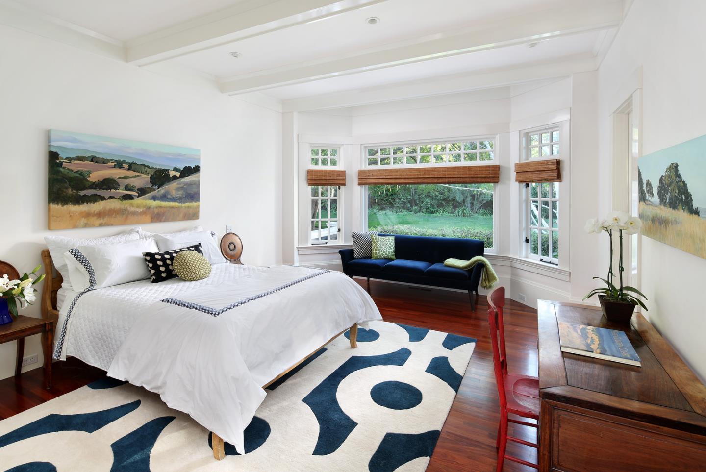 137 Moore Road Woodside, CA 94062 - Photo 17 of 22 a bedroom with a bed and wooden floor
