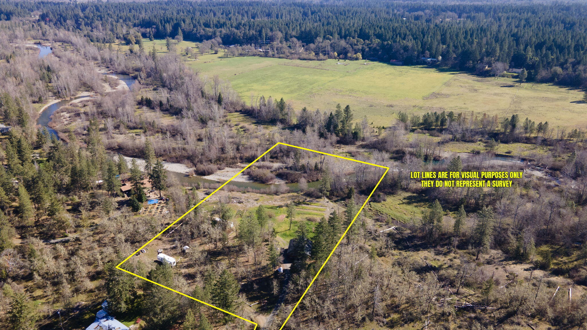 5737 Rockydale Road Cave Junction, OR 97523 - Photo 16 of 39 a view of a swimming pool with a yard