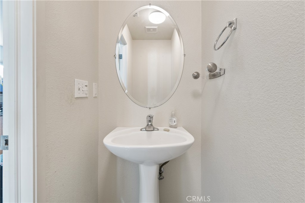 4357 Mathias Way Merced, CA 95348 - Photo 11 of 32 a bathroom with a sink and a mirror