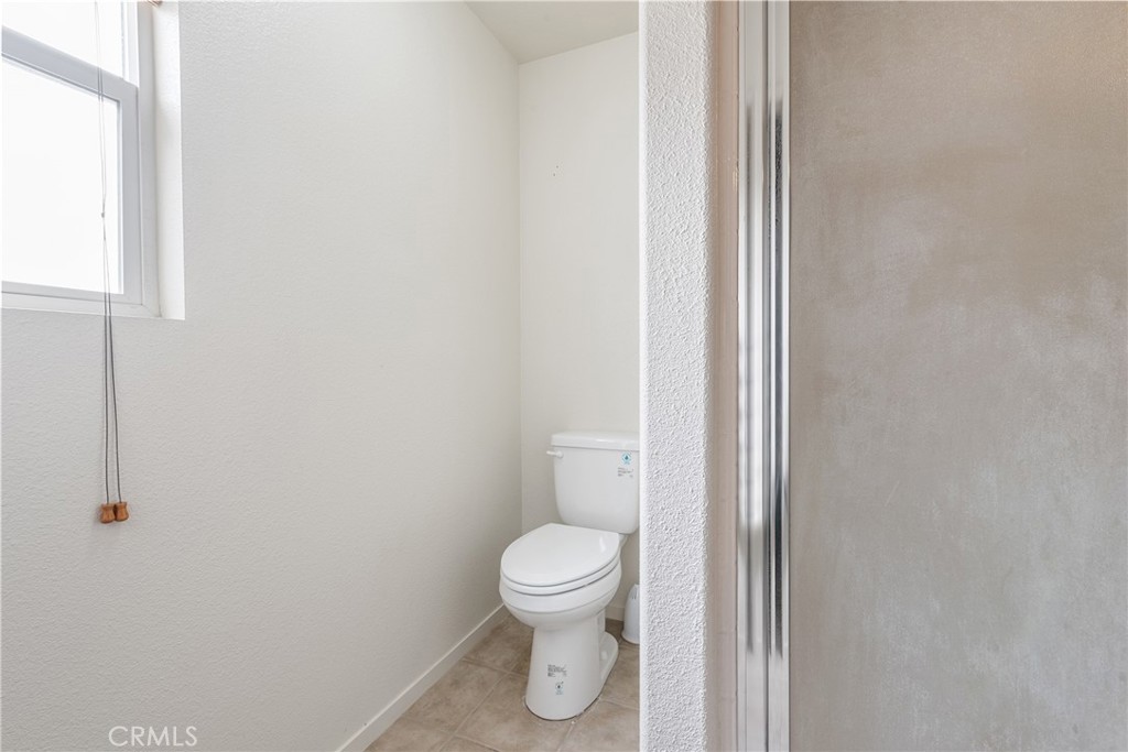 4357 Mathias Way Merced, CA 95348 - Photo 17 of 32 a bathroom with a toilet