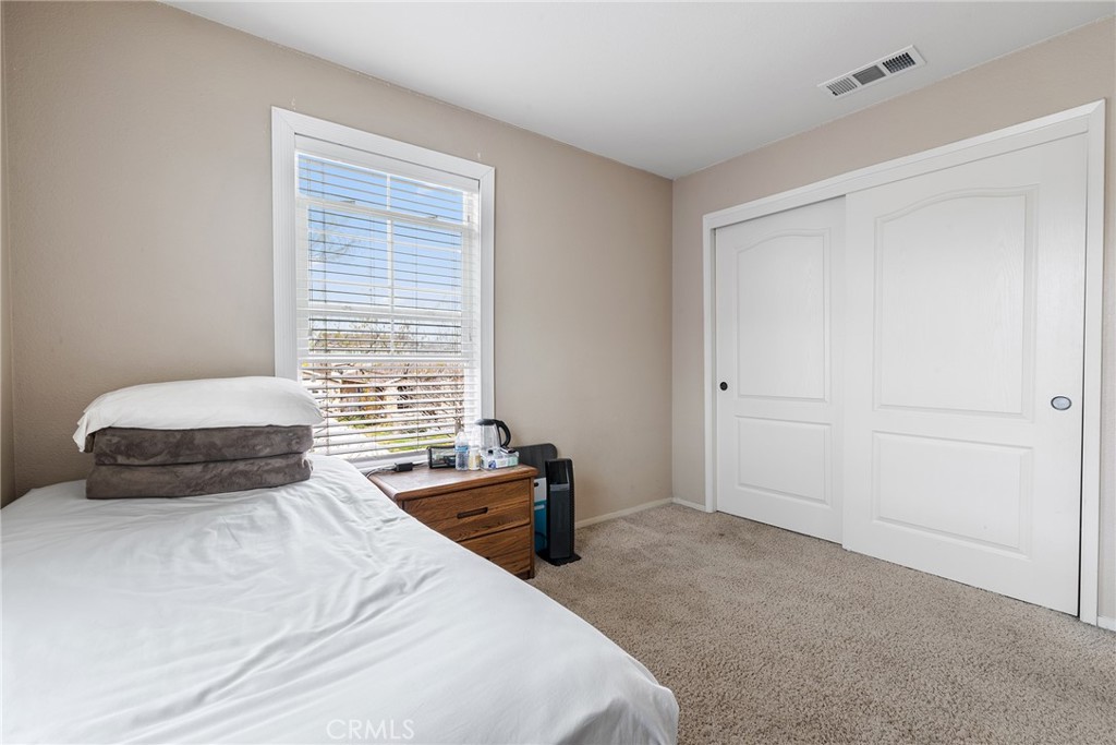 4357 Mathias Way Merced, CA 95348 - Photo 19 of 32 a bedroom with a bed and a window