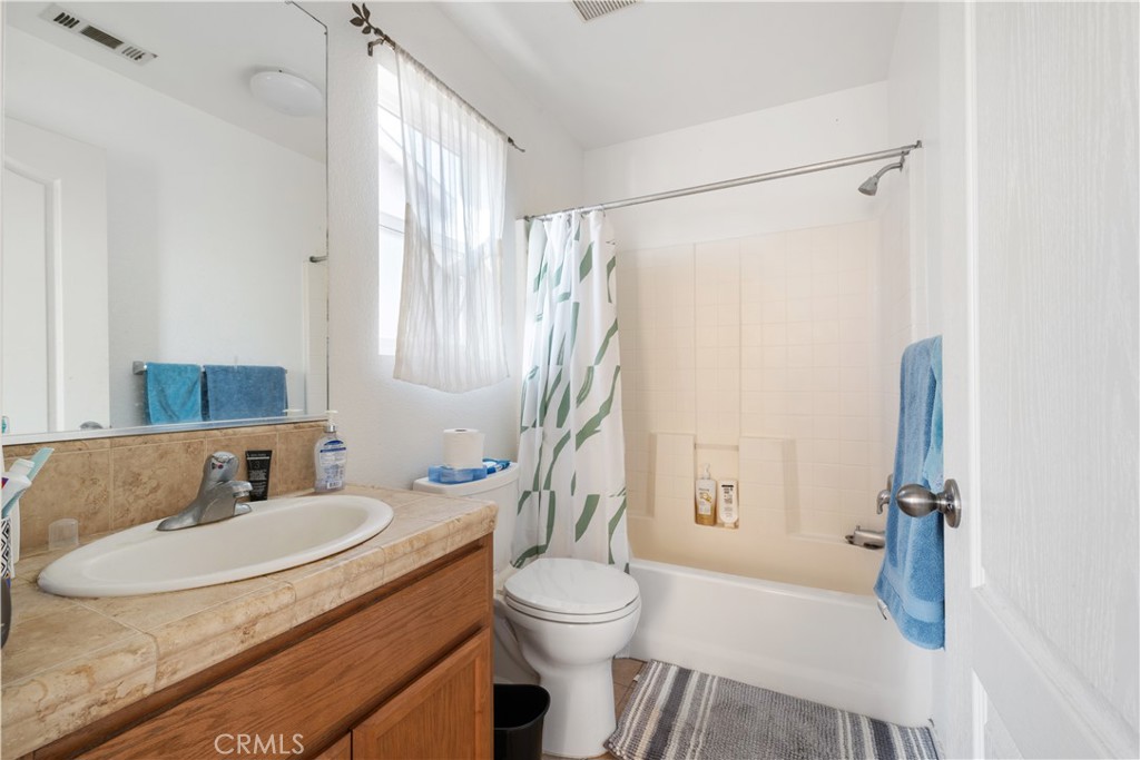 4357 Mathias Way Merced, CA 95348 - Photo 21 of 32 a bathroom with a sink toilet and shower