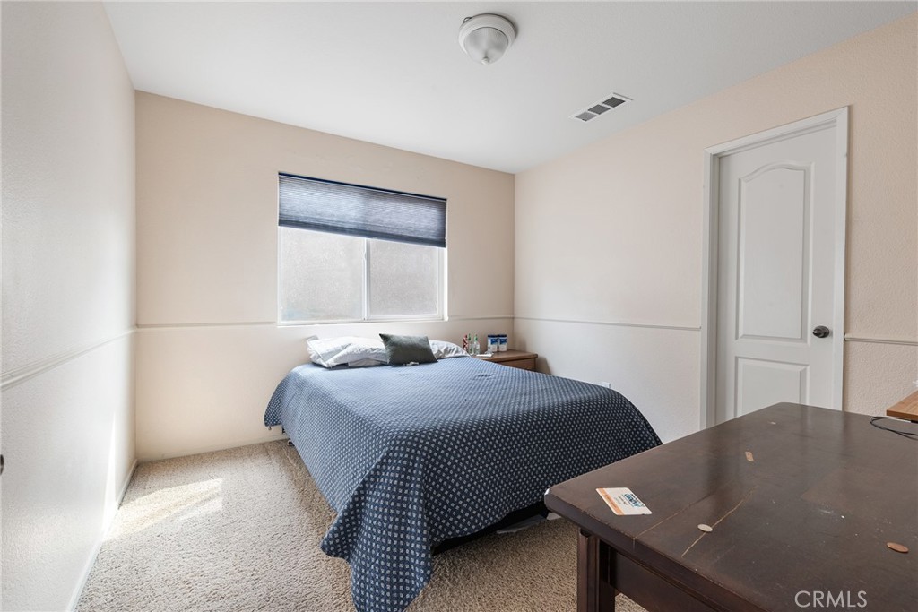 4357 Mathias Way Merced, CA 95348 - Photo 22 of 32 a bedroom with a bed and window