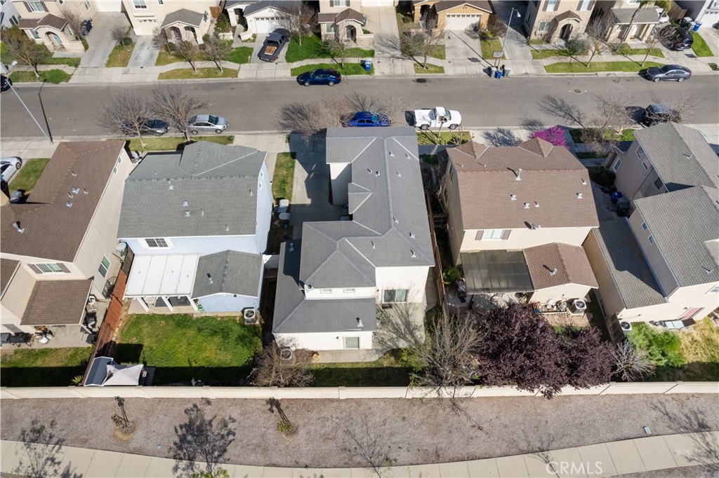 4357 Mathias Way Merced, CA 95348 - Photo 30 of 32 an aerial view of residential houses with outdoor space and parking