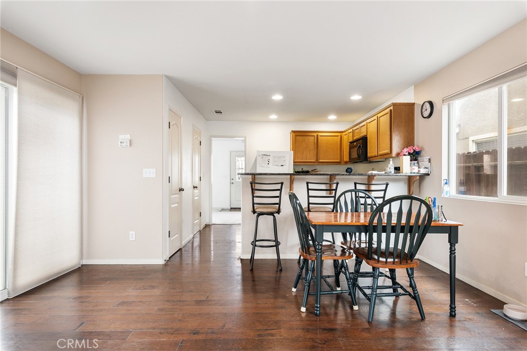 4357 Mathias Way Merced, CA 95348 - Photo 10 of 32 a dining room with furniture and wooden floor