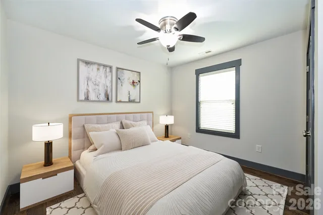 a bedroom with bed and window