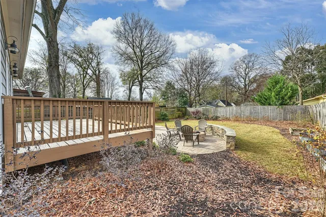 a view of a back yard with a table and chair