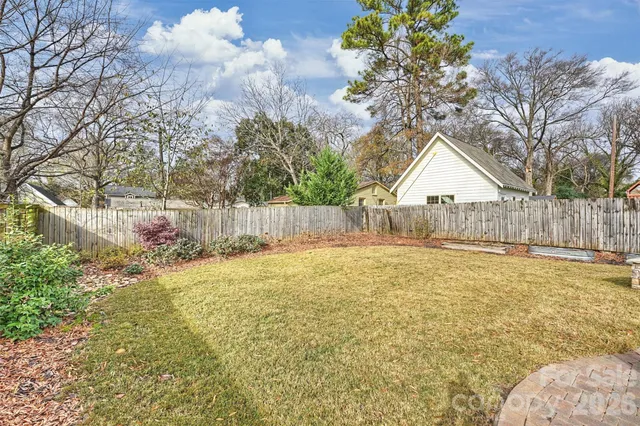 a swimming pool with wooden fence
