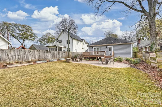 a swimming pool is sitting in the middle of a yard