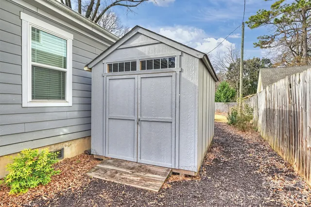 a porch with a door in front of a house