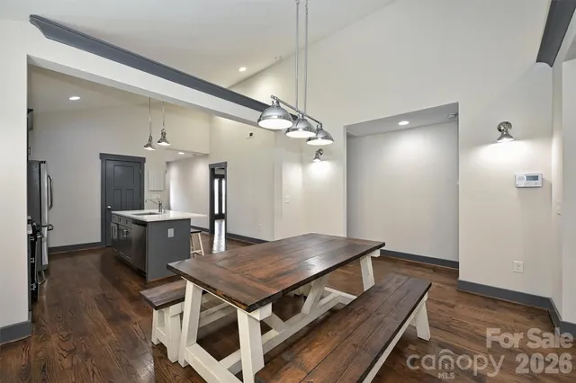 a kitchen that has a table and chairs in it