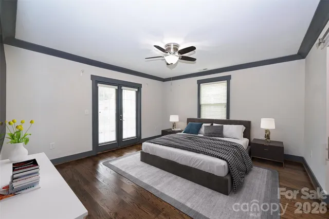 a spacious bedroom with a bed and a window