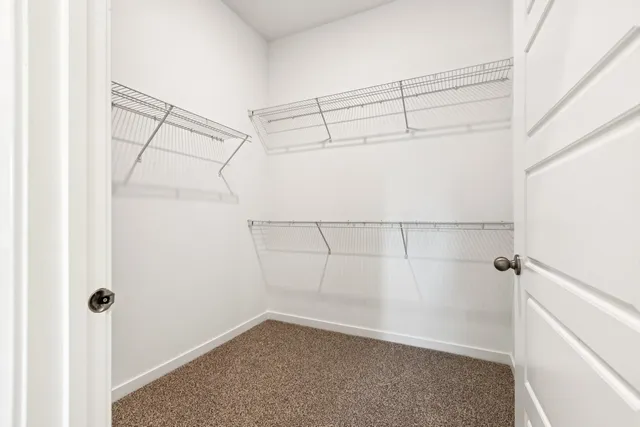 a front view of a house with a garden and yard