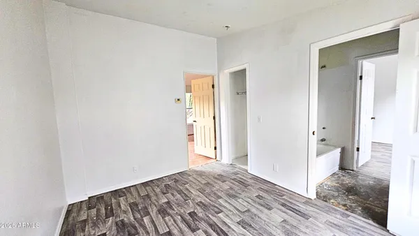 a bathroom with a bathtub and a window
