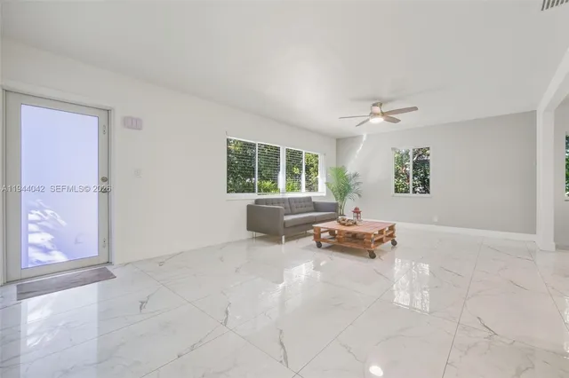 a living room with furniture and a window
