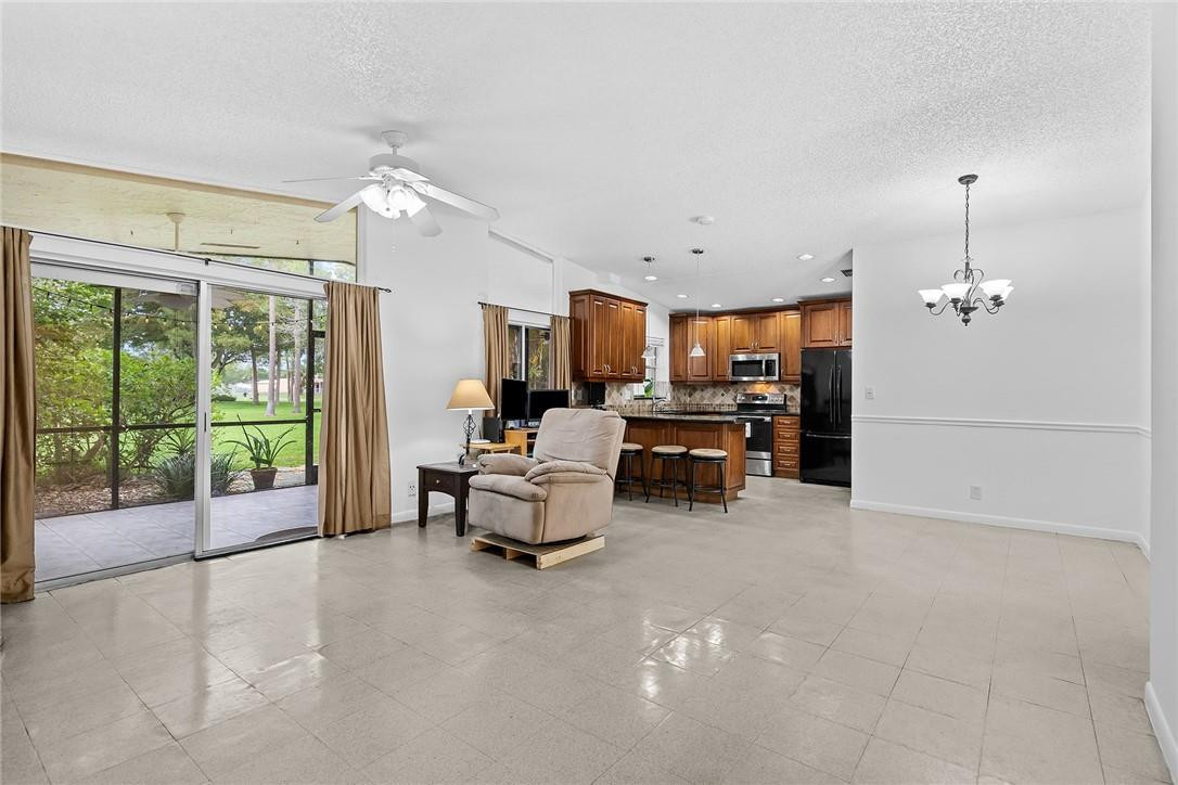 Undisclosed Address Boca Raton, FL 33428 - Photo 11 of 35 a view of a livingroom with furniture and floor to ceiling window