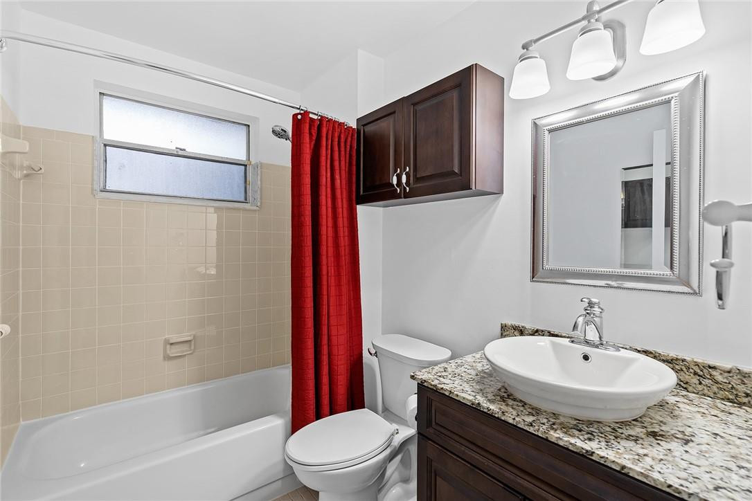 Undisclosed Address Boca Raton, FL 33428 - Photo 21 of 35 a bathroom with a granite countertop sink toilet and shower