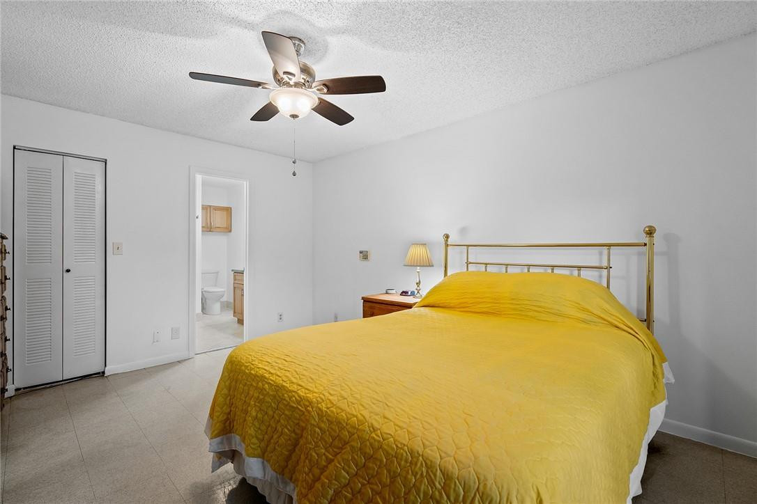 Undisclosed Address Boca Raton, FL 33428 - Photo 22 of 35 a bedroom with a bed and window
