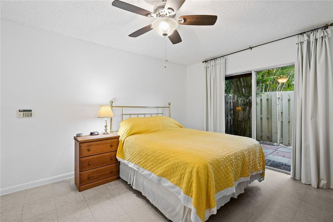 Undisclosed Address Boca Raton, FL 33428 - Photo 23 of 35 a bedroom with a bed and window
