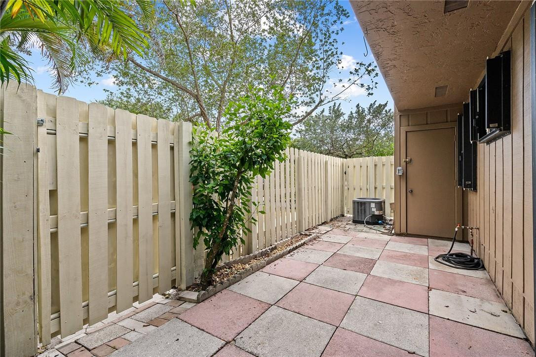 Undisclosed Address Boca Raton, FL 33428 - Photo 29 of 35 a view of a house with backyard and trees